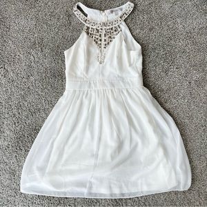 Formal white mini dress with jeweled halter